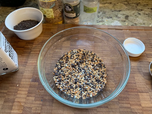 A photo of my cutting board with a bowl of all the ingredients.