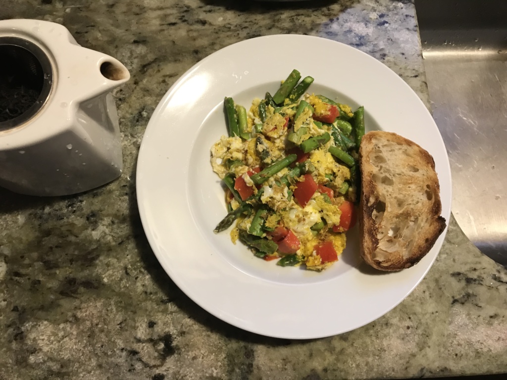 Photo of my breakfast, asparagus and red bell pepper scramble wiht a slice of toasted rye.