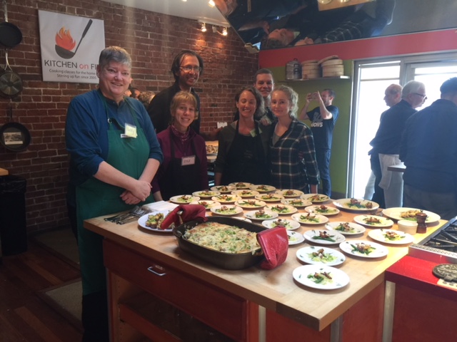 Photo of Patty and other students at a Kitchen on Fire food class.