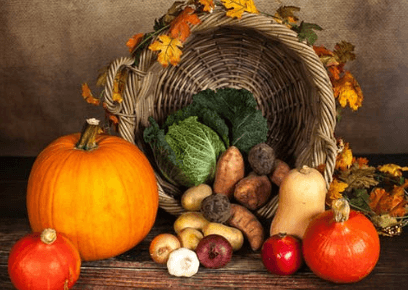 Photo of a cornucopia and fall foods.