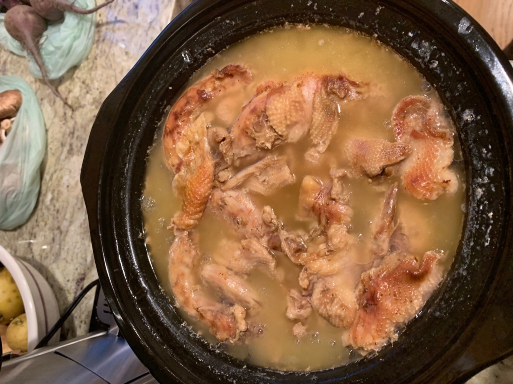 Photo of a pot of chicken bone broth.