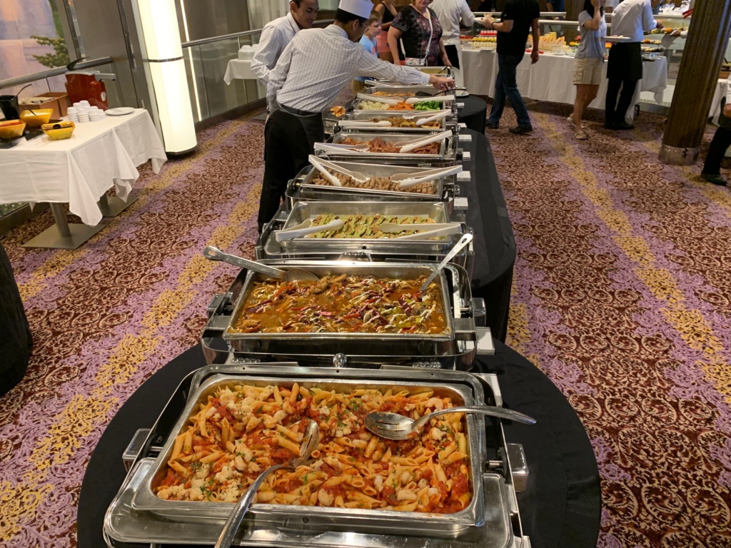 Photo of a buffet of broiled, baked, and fried food available on a Royal Caribbean ship. 