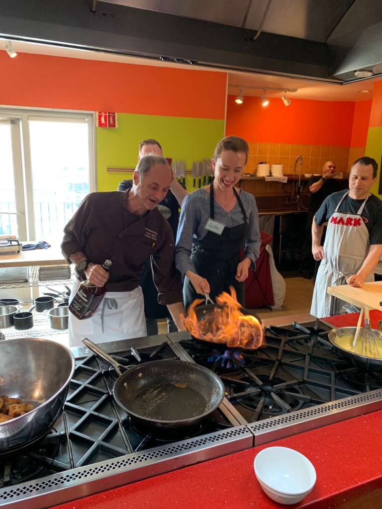 Photo of a Kitchen On Fire student learning to cook with fire.