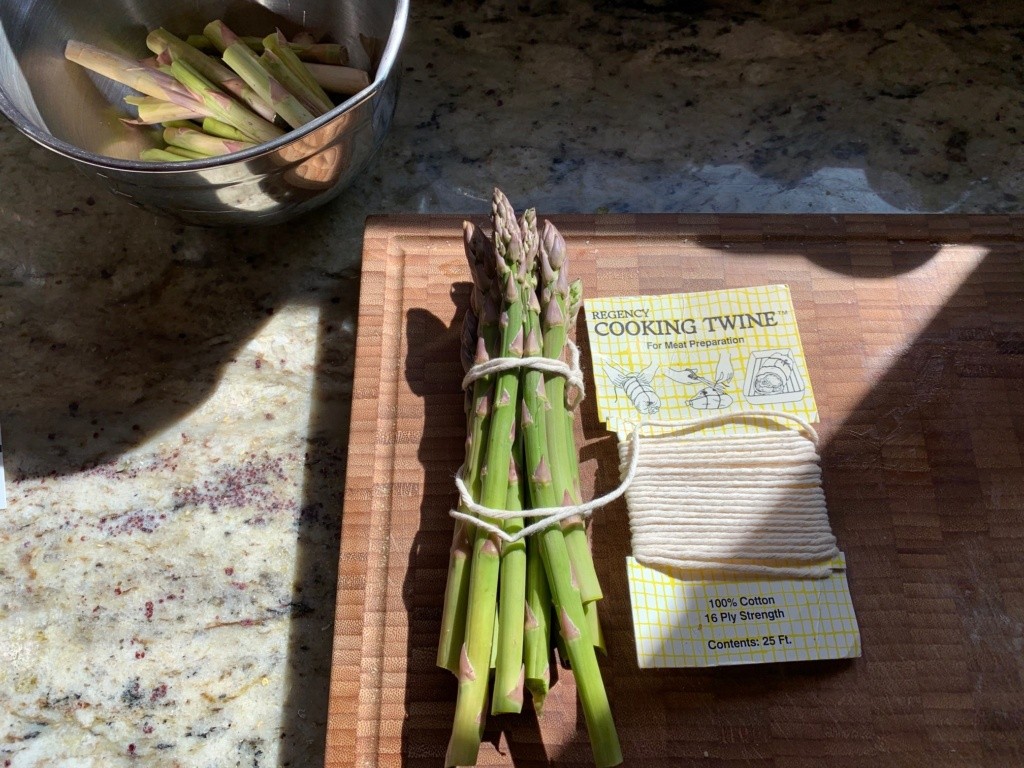 Photo of a twine-wrapped bundle of asparagus.