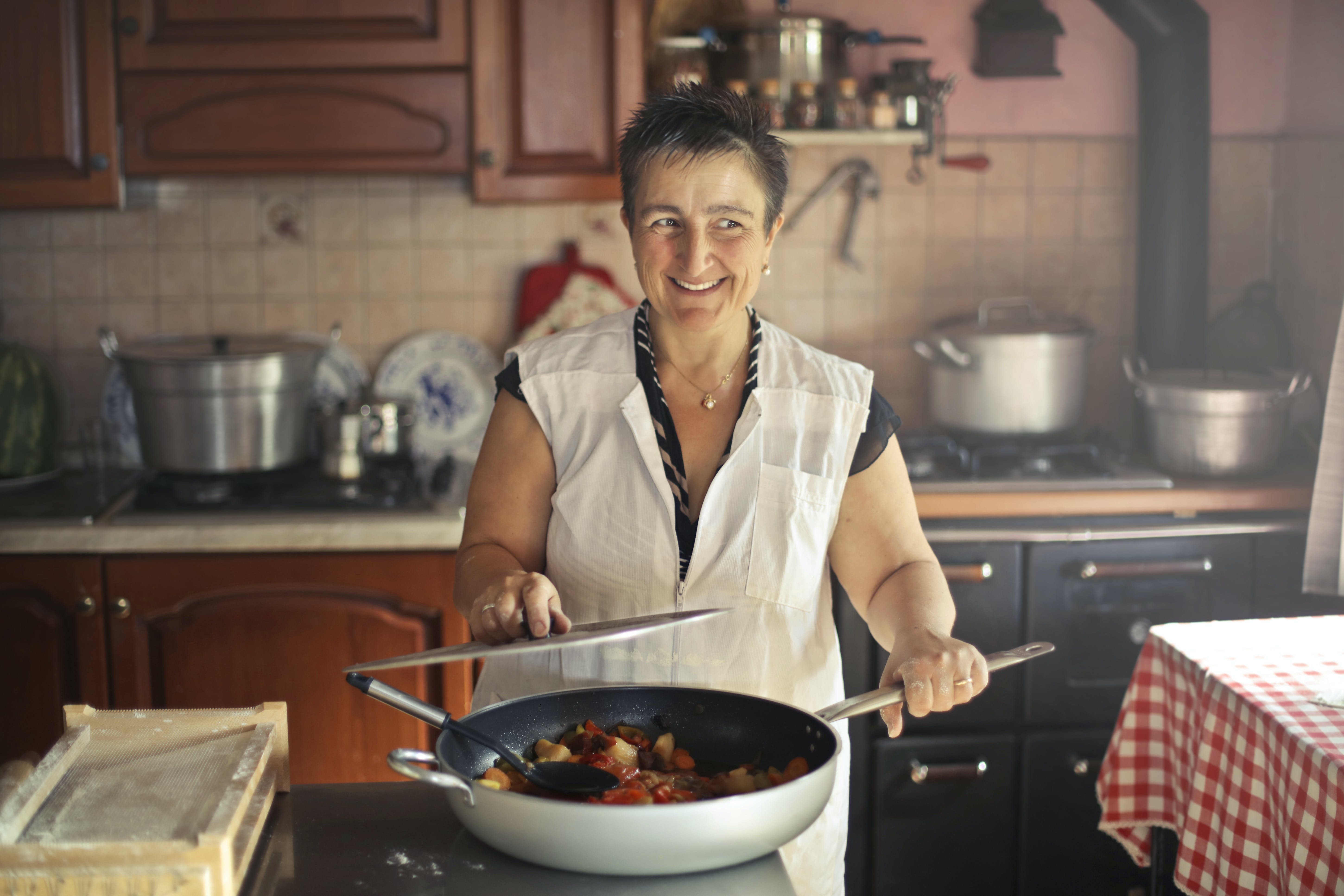 Woman Wearing Apron While Smiling