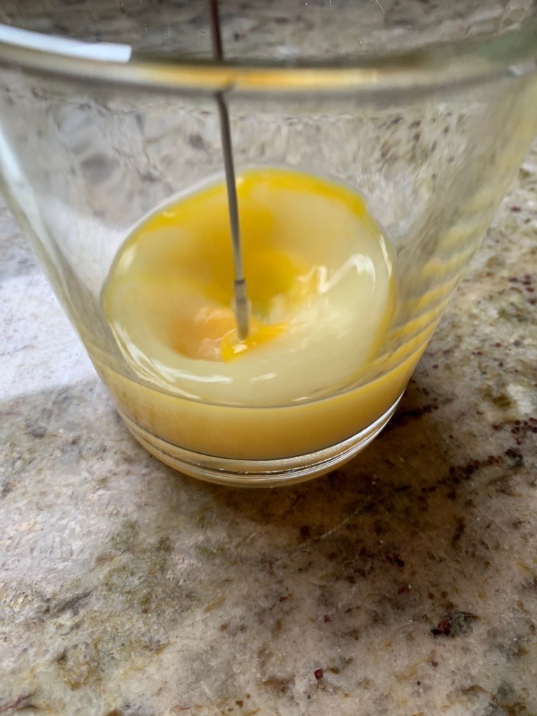 Photo whisking an egg with milk.