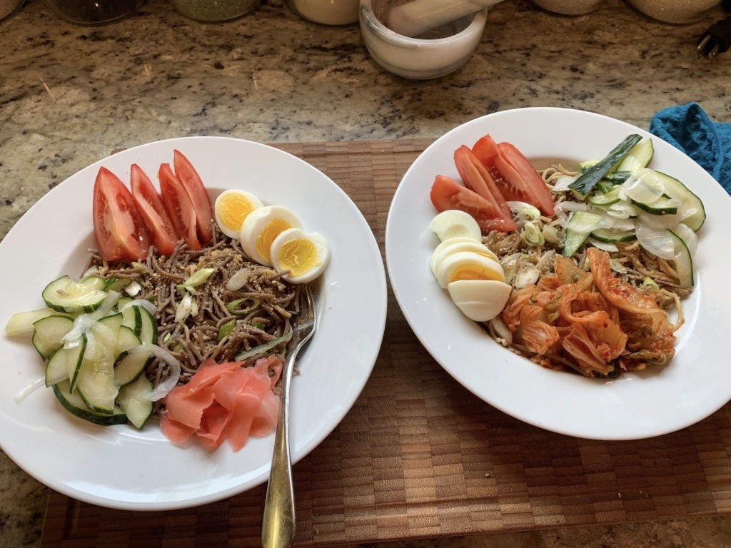  Photo of two variations of the dish with different fermented food and noodles.