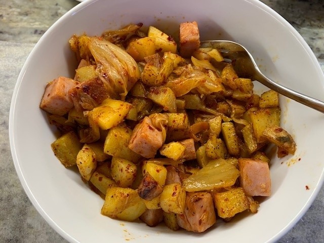 Photo of a bowl of kimchi ham hash.