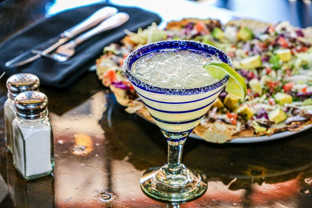 Pixabay photo of a drink and colorul nachos.