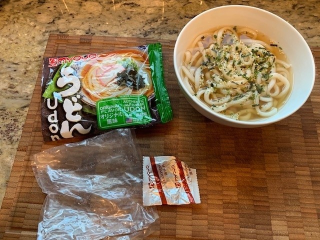 The soup packaging along with a bowl of udon noodle soup toped with my homemade Furikake seasoning.