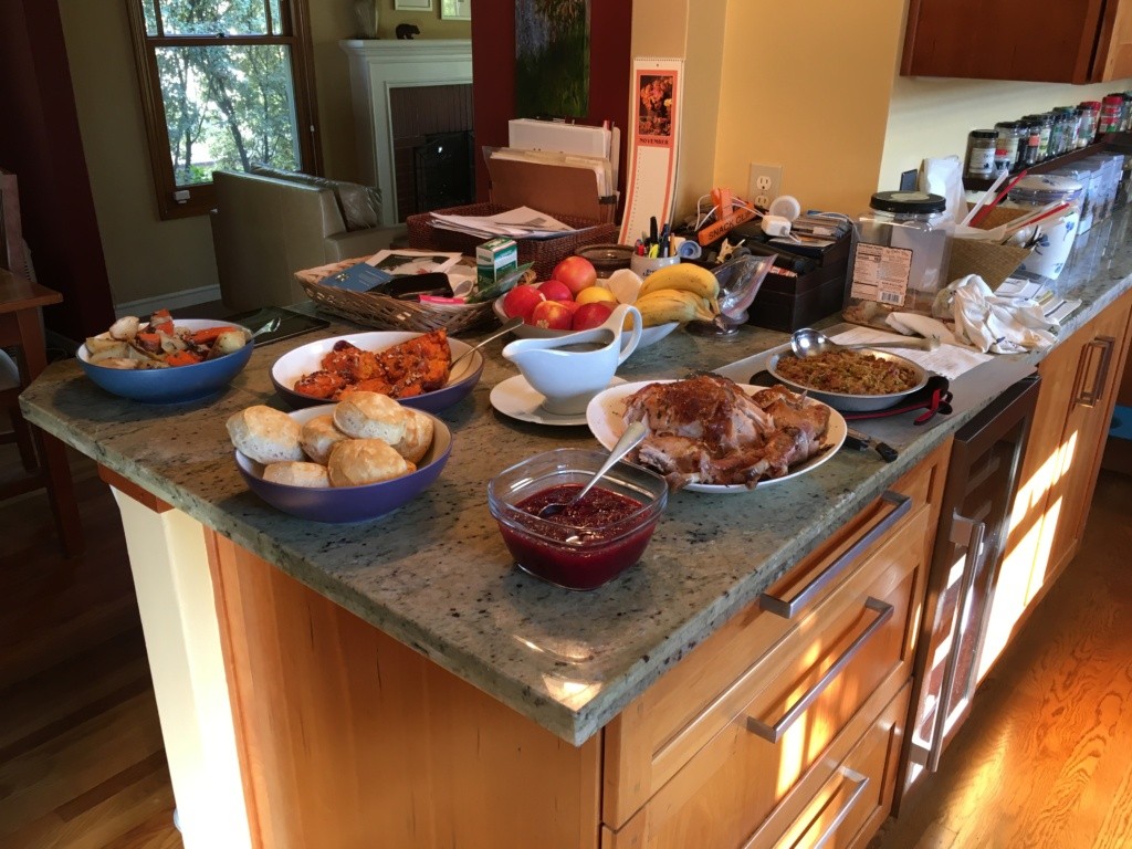 A picture of my kitchen counter with all the dishes on top ready for serving.