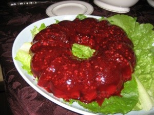 Cranberry jello salad molded into a common ring shape.