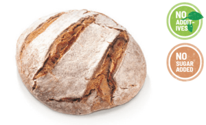 A rye sourdough bread loaf that is small and round.