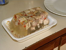 A picture of chopped meat in a gelatin loaf form.