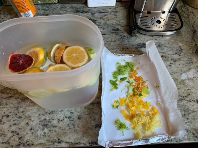 A picture of making a citrus blend of spa water, and zested orange, lime, lemon, and blood orange.