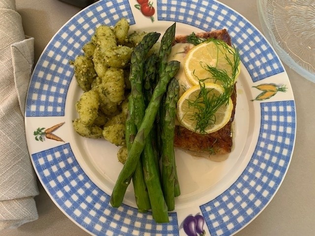 A checkered blue plate with variations of food colored in the green to yellow pwectrum.